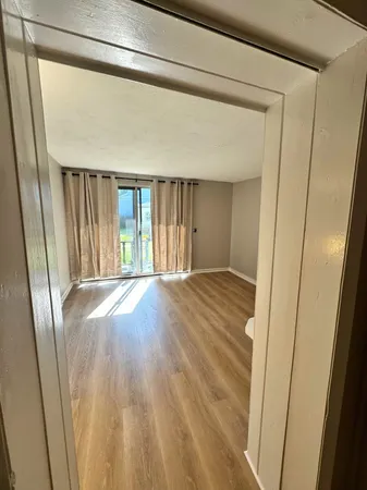 a view of entryway with wooden floor