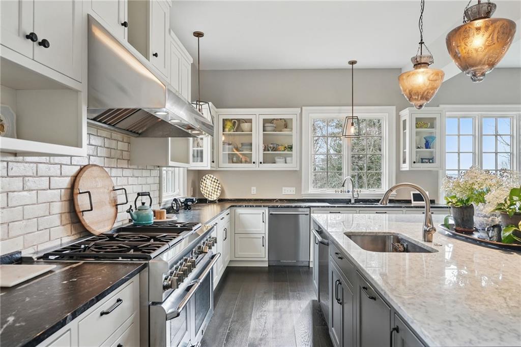 743 Chestnut Road Sewickley, PA 15143 - Photo 11 of 40 a kitchen with a stove and a sink