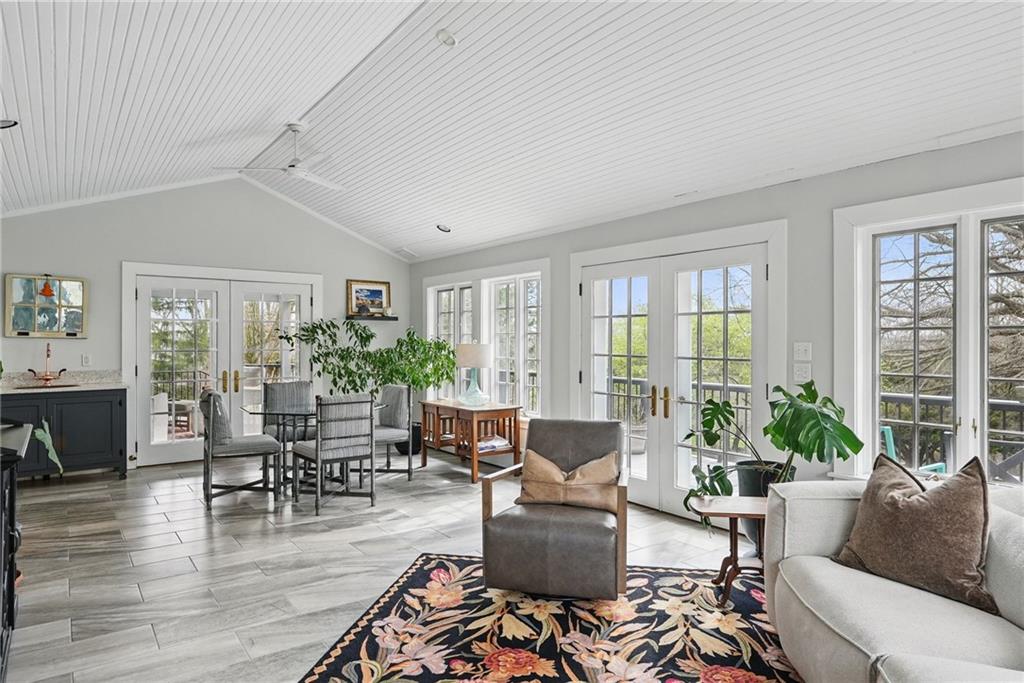 743 Chestnut Road Sewickley, PA 15143 - Photo 16 of 40 a living room with furniture potted plant and floor to ceiling windows