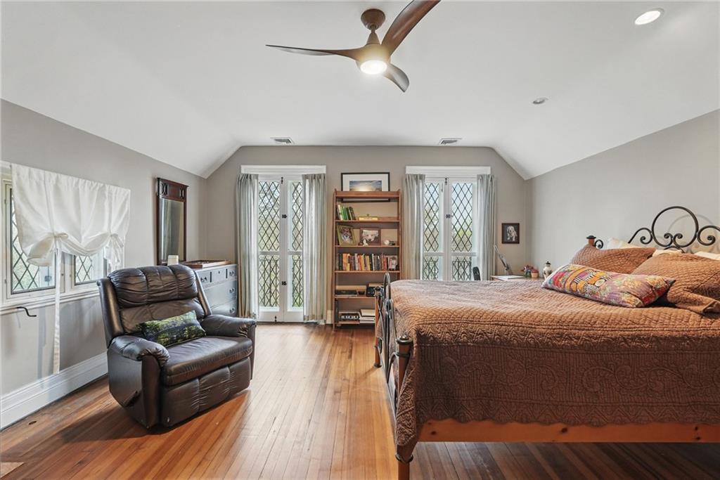 743 Chestnut Road Sewickley, PA 15143 - Photo 18 of 40 a bedroom with a large bed a couch and a window