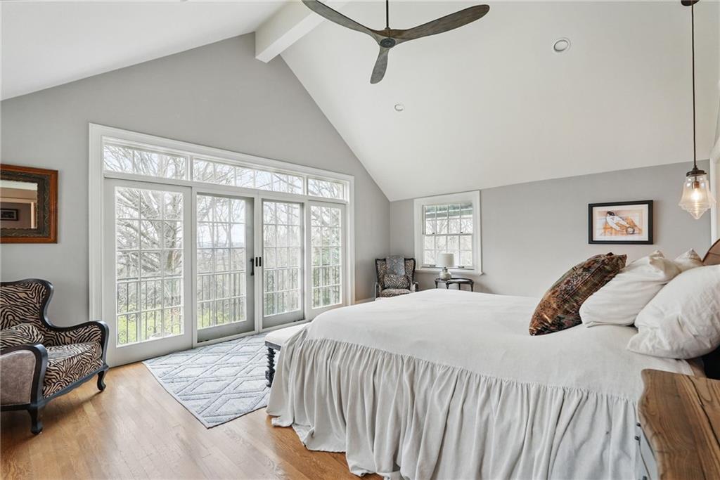 743 Chestnut Road Sewickley, PA 15143 - Photo 20 of 40 a bedroom with a bed and glass window