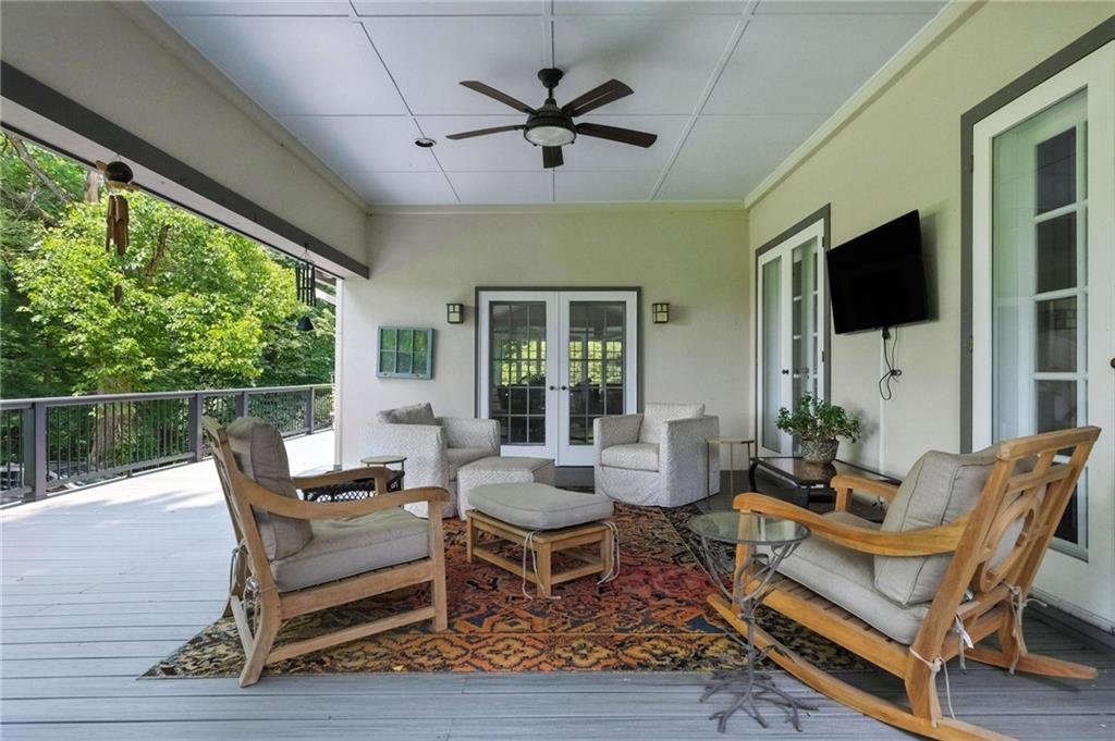 743 Chestnut Road Sewickley, PA 15143 - Photo 28 of 40 a living room with furniture a flat screen tv and a large window