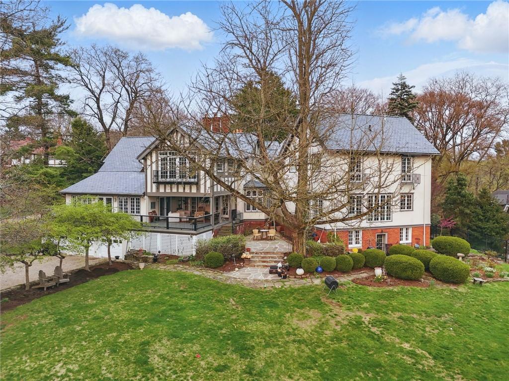 743 Chestnut Road Sewickley, PA 15143 - Photo 32 of 40 a view of a house with a big yard potted plants and large tree