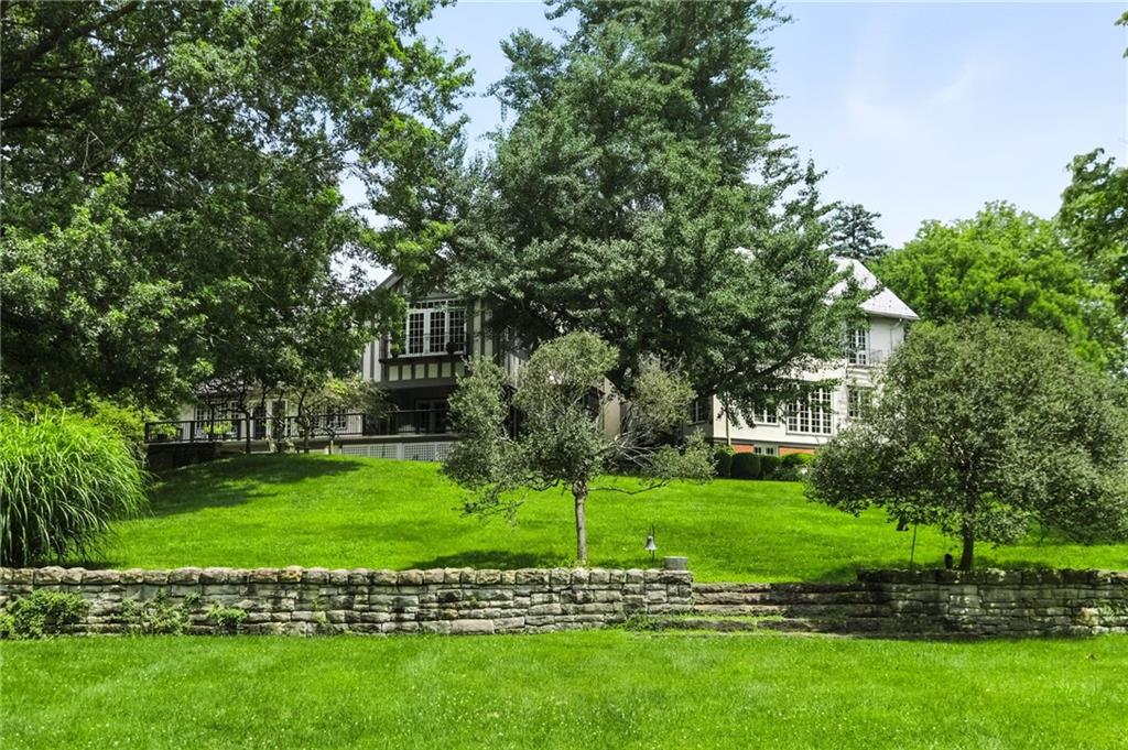 743 Chestnut Road Sewickley, PA 15143 - Photo 34 of 40 a view of a house with a big yard and potted plants and large trees
