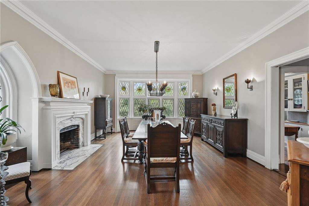 743 Chestnut Road Sewickley, PA 15143 - Photo 5 of 40 a dining room with furniture window fireplace and wooden floor