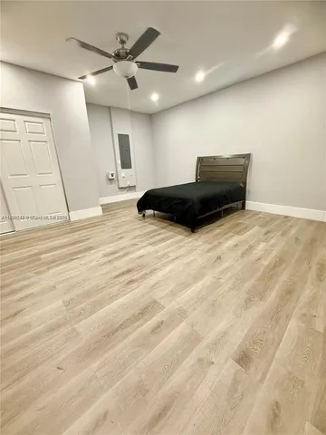 a view of kitchen and empty room