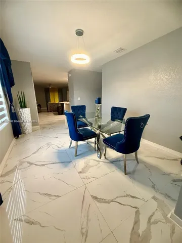 a bedroom with furniture and a rug