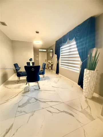 a view of a couch and chair in the livingroom