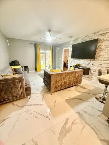 a living room with a couch and a flat screen tv