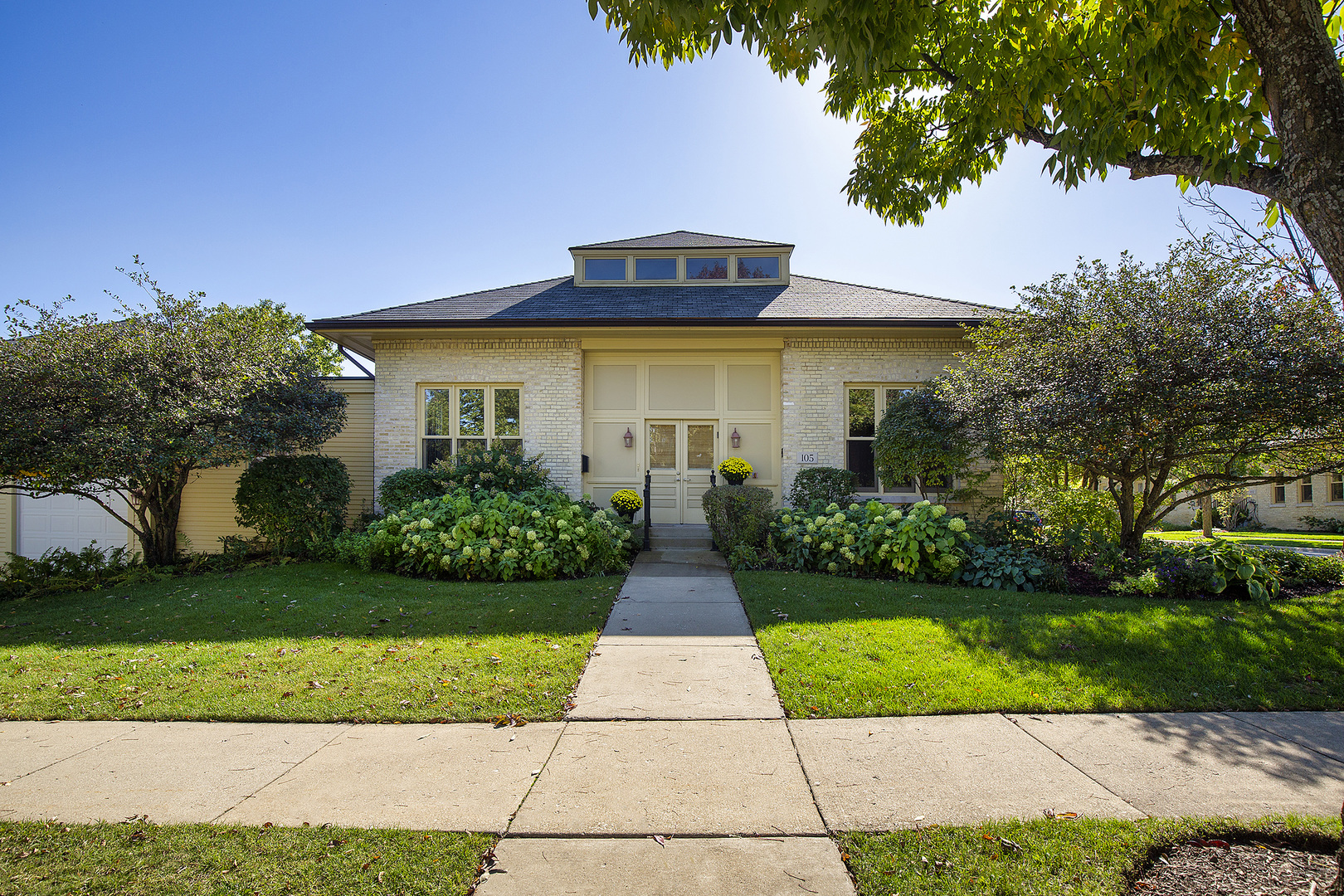 a front view of a house with yard