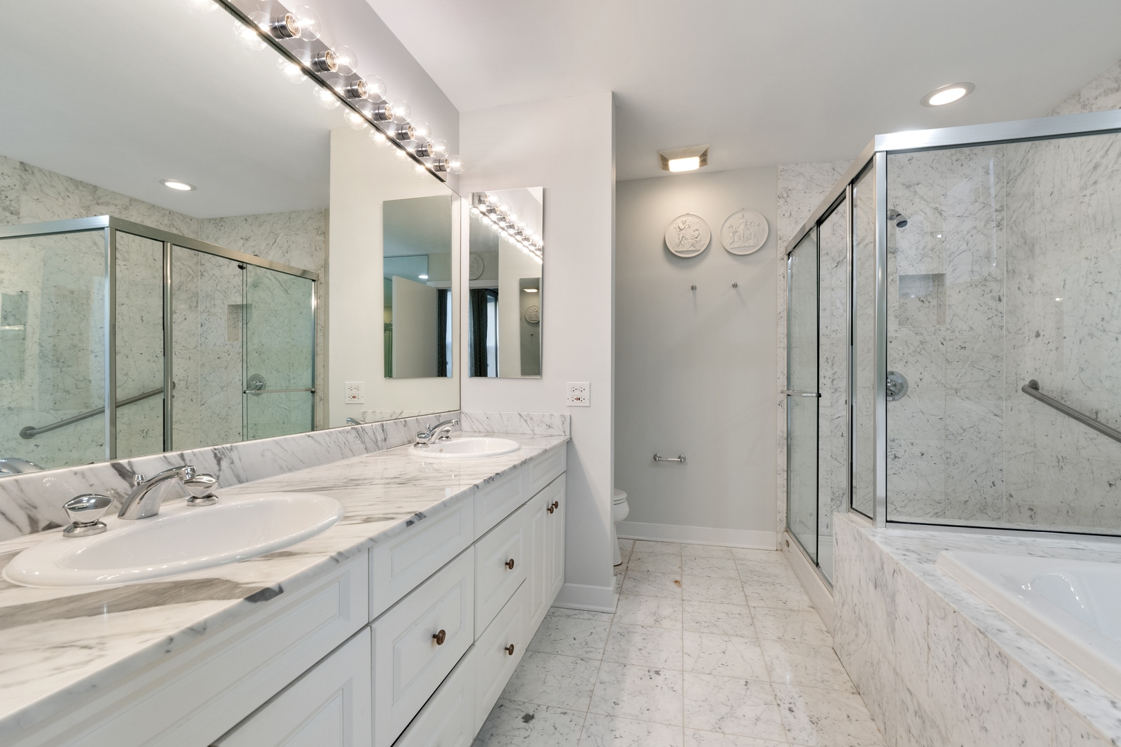 105 Ronan Road Highwood, IL 60040 - Photo 15 of 21 a bathroom with a granite countertop sink a mirror a shower and a bathtub
