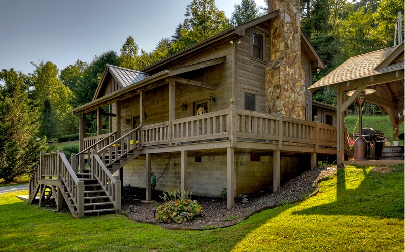 349 Sunrise Road Blue Ridge, GA 30513 - Photo 1 of 1 a view of a house with a yard deck and sitting area