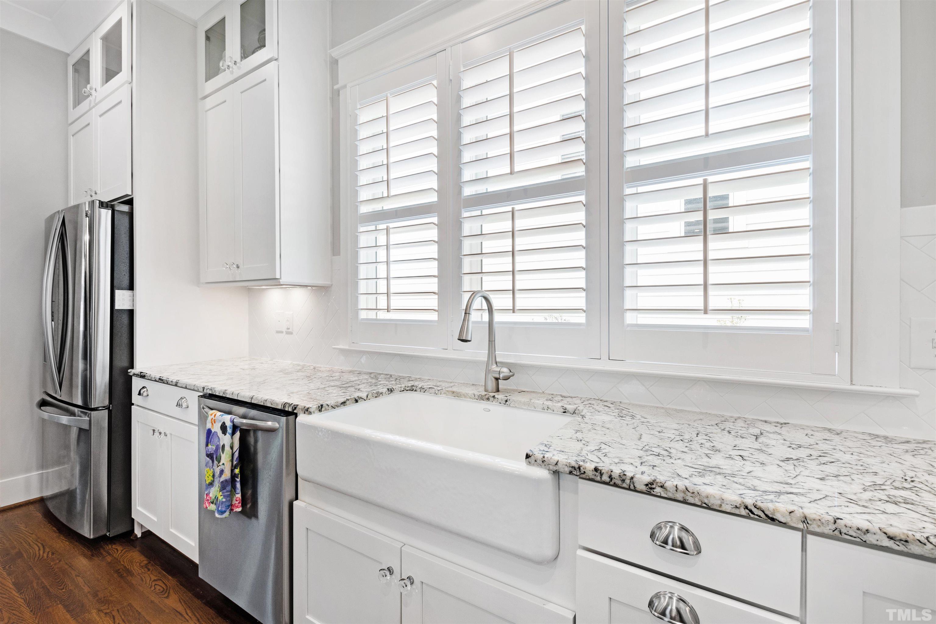 721 Virginia Avenue Raleigh, NC 27604 - Photo 17 of 49 a kitchen with granite countertop a sink and a window
