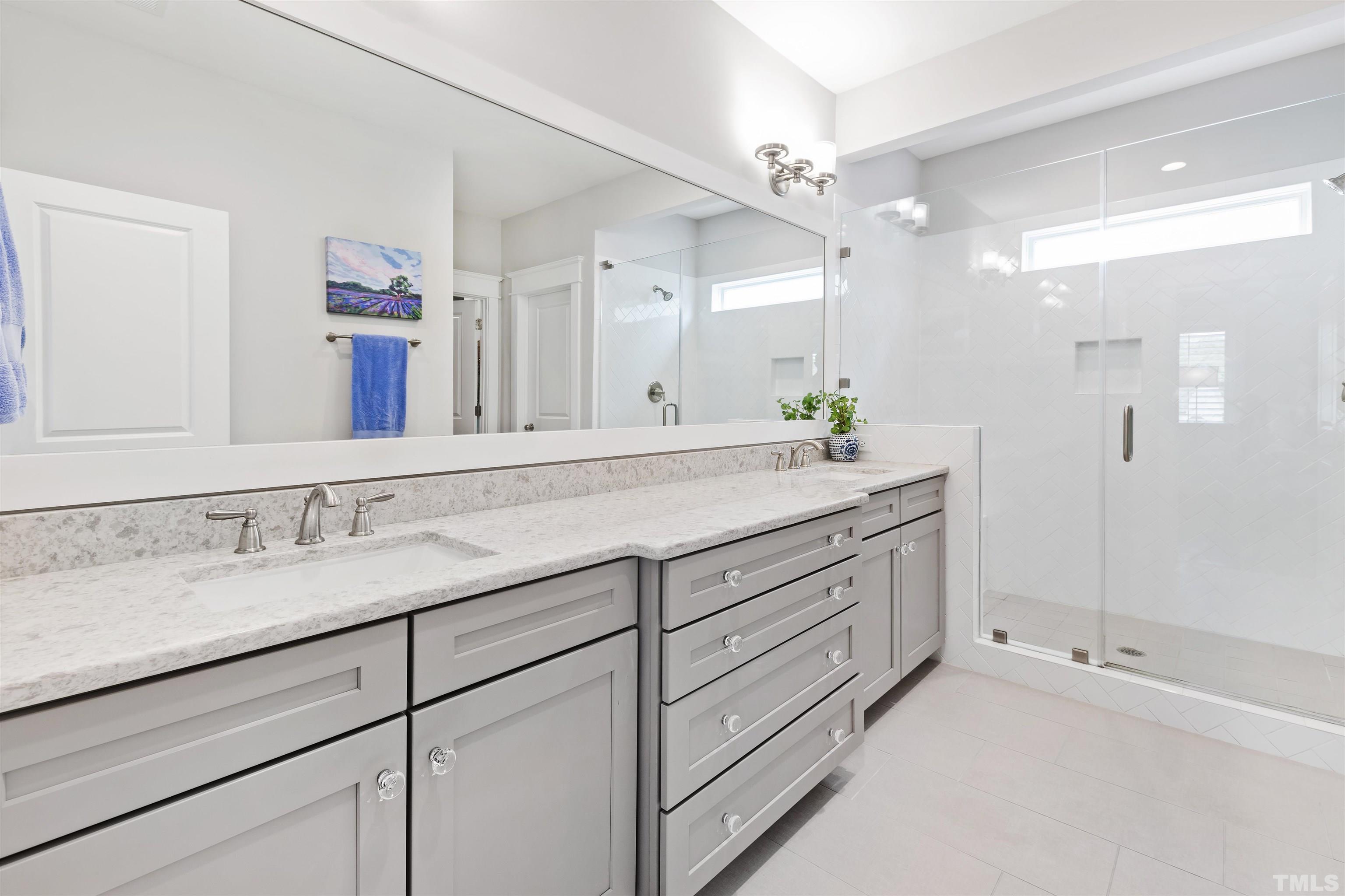 721 Virginia Avenue Raleigh, NC 27604 - Photo 27 of 49 a bathroom with a sink and a mirror