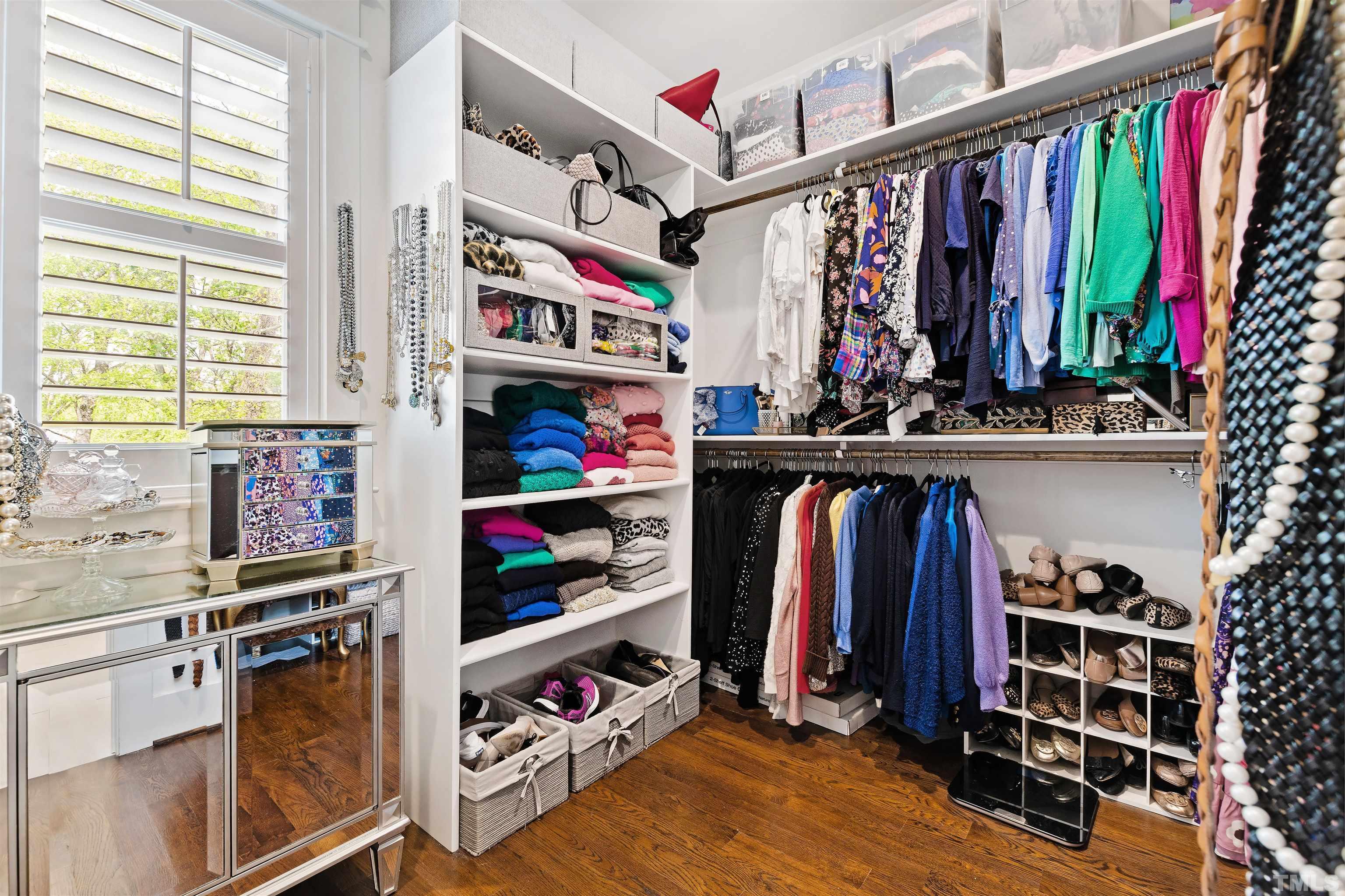 721 Virginia Avenue Raleigh, NC 27604 - Photo 29 of 49 a view of walk in closet with clothes and shoes
