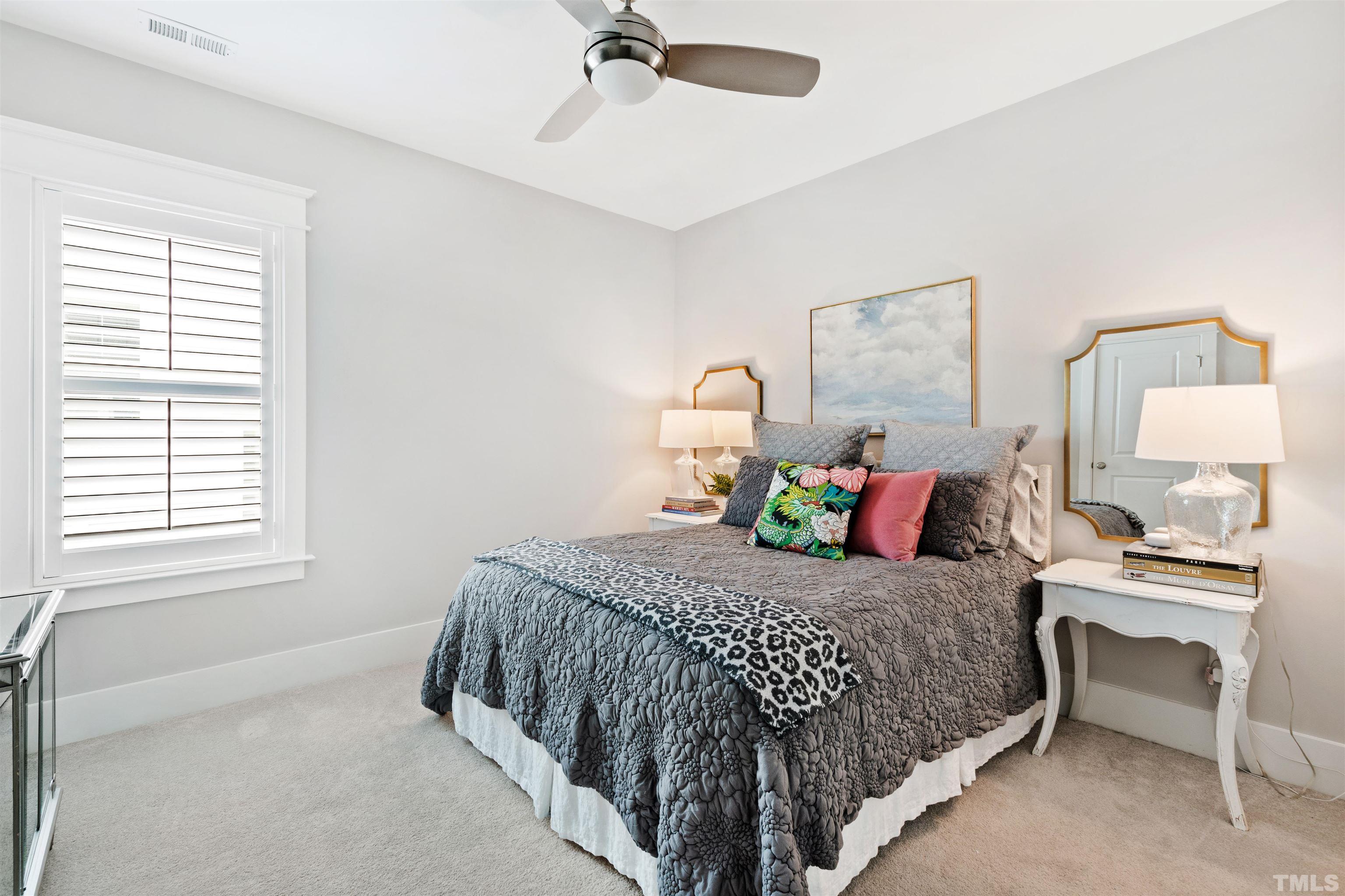 721 Virginia Avenue Raleigh, NC 27604 - Photo 30 of 49 a bedroom with a bed and a table