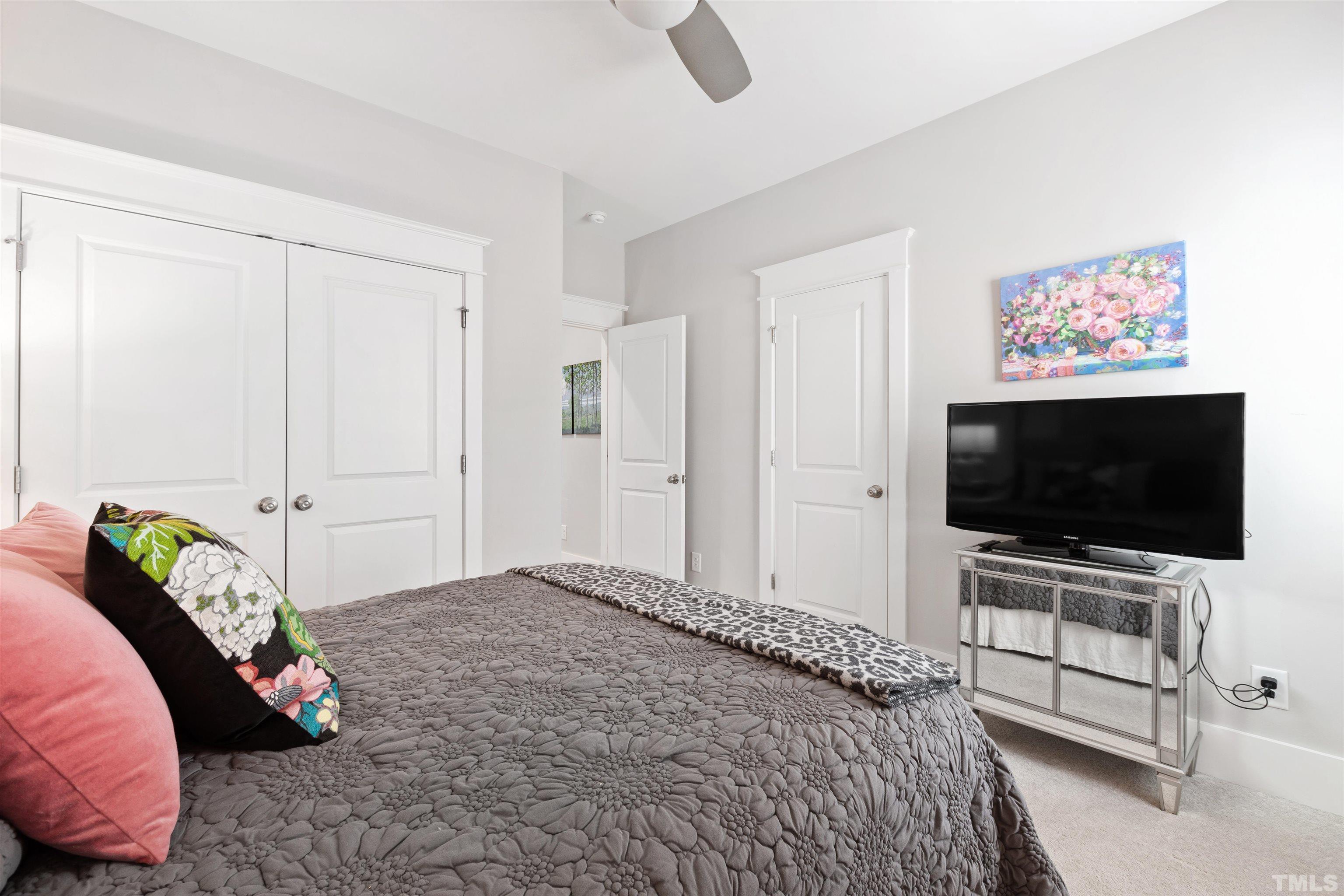 721 Virginia Avenue Raleigh, NC 27604 - Photo 31 of 49 a bedroom with a bed and a television in it