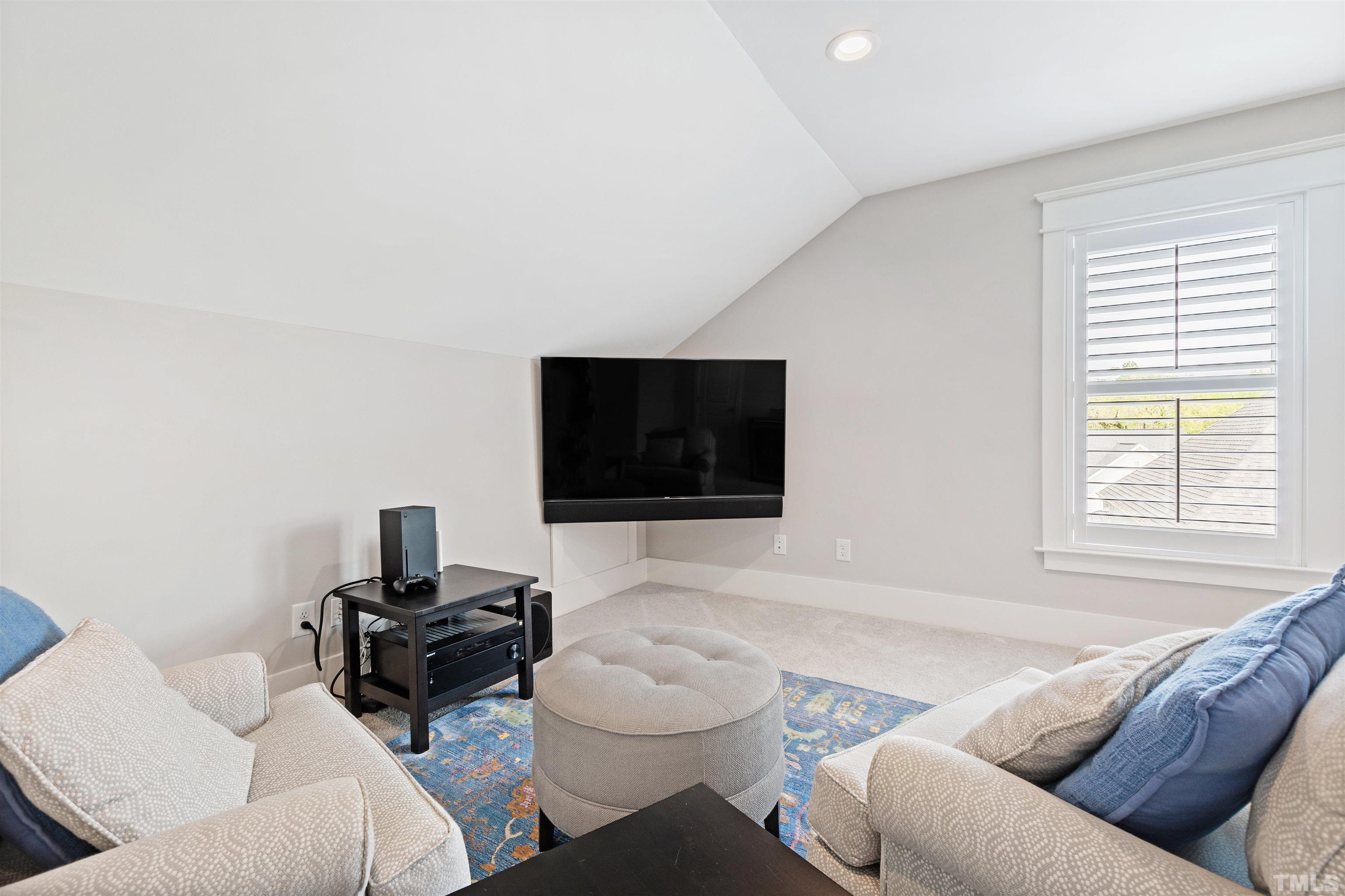 721 Virginia Avenue Raleigh, NC 27604 - Photo 38 of 49 a living room with furniture and a flat screen tv