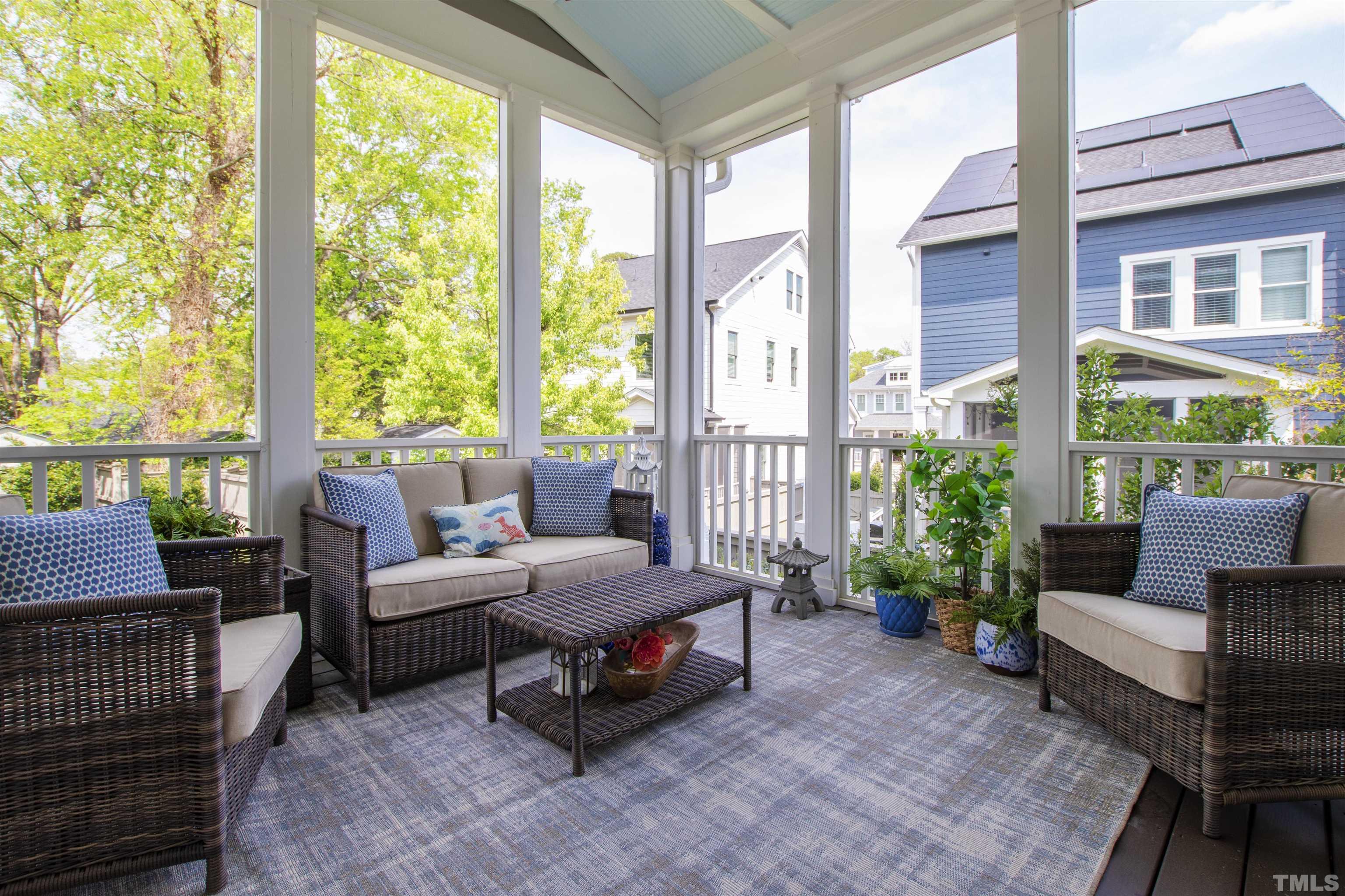 721 Virginia Avenue Raleigh, NC 27604 - Photo 44 of 49 a outdoor living space with furniture and a floor to ceiling window