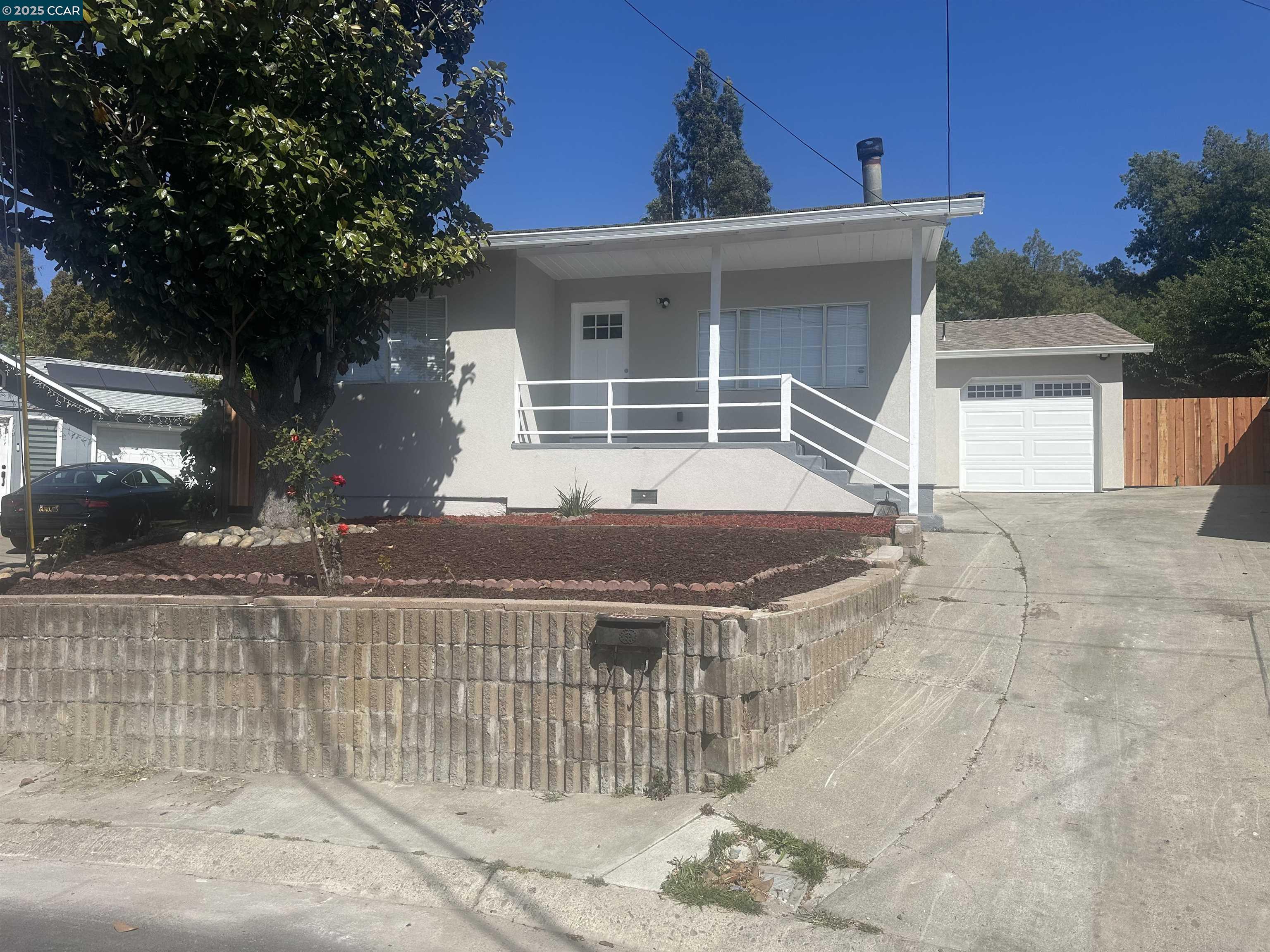 a front view of a house with a porch