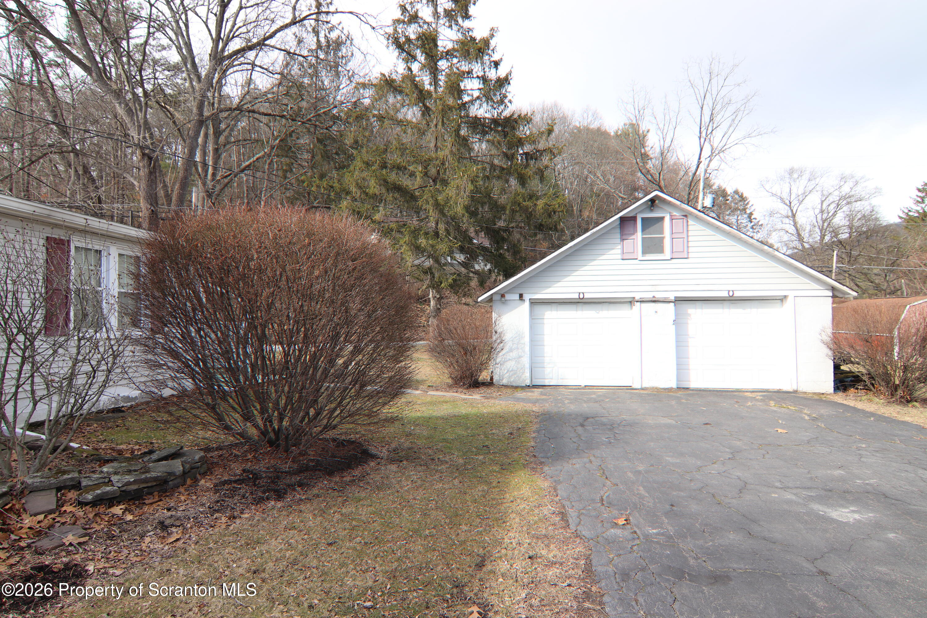 502 State Rte 92 South Tunkhannock, PA 18657 - Photo 38 of 52 a front view of a house with a yard and garage