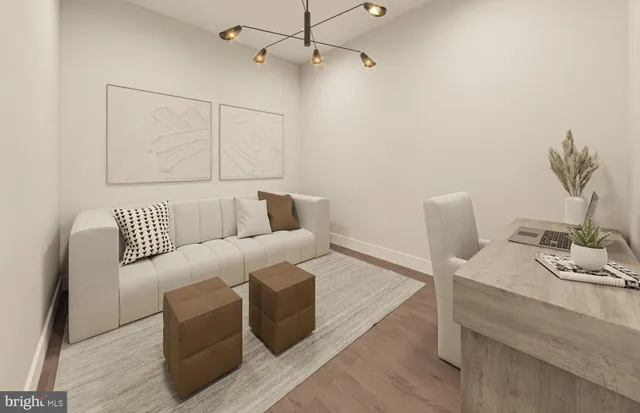 a living room with furniture a flat screen tv and a large window