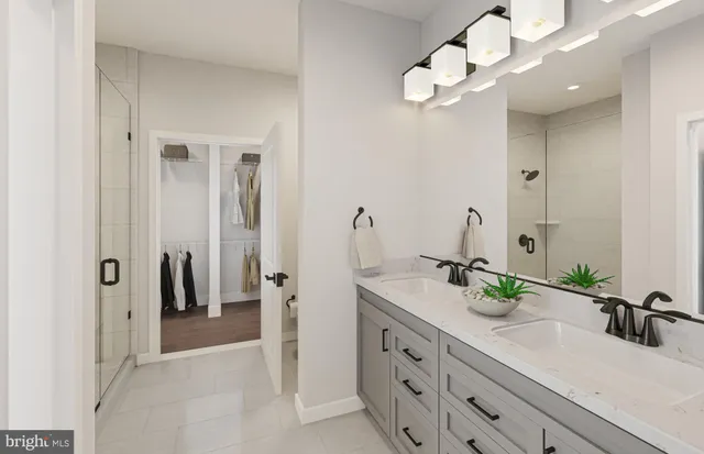 a bedroom with a bed painting on wall and a large window