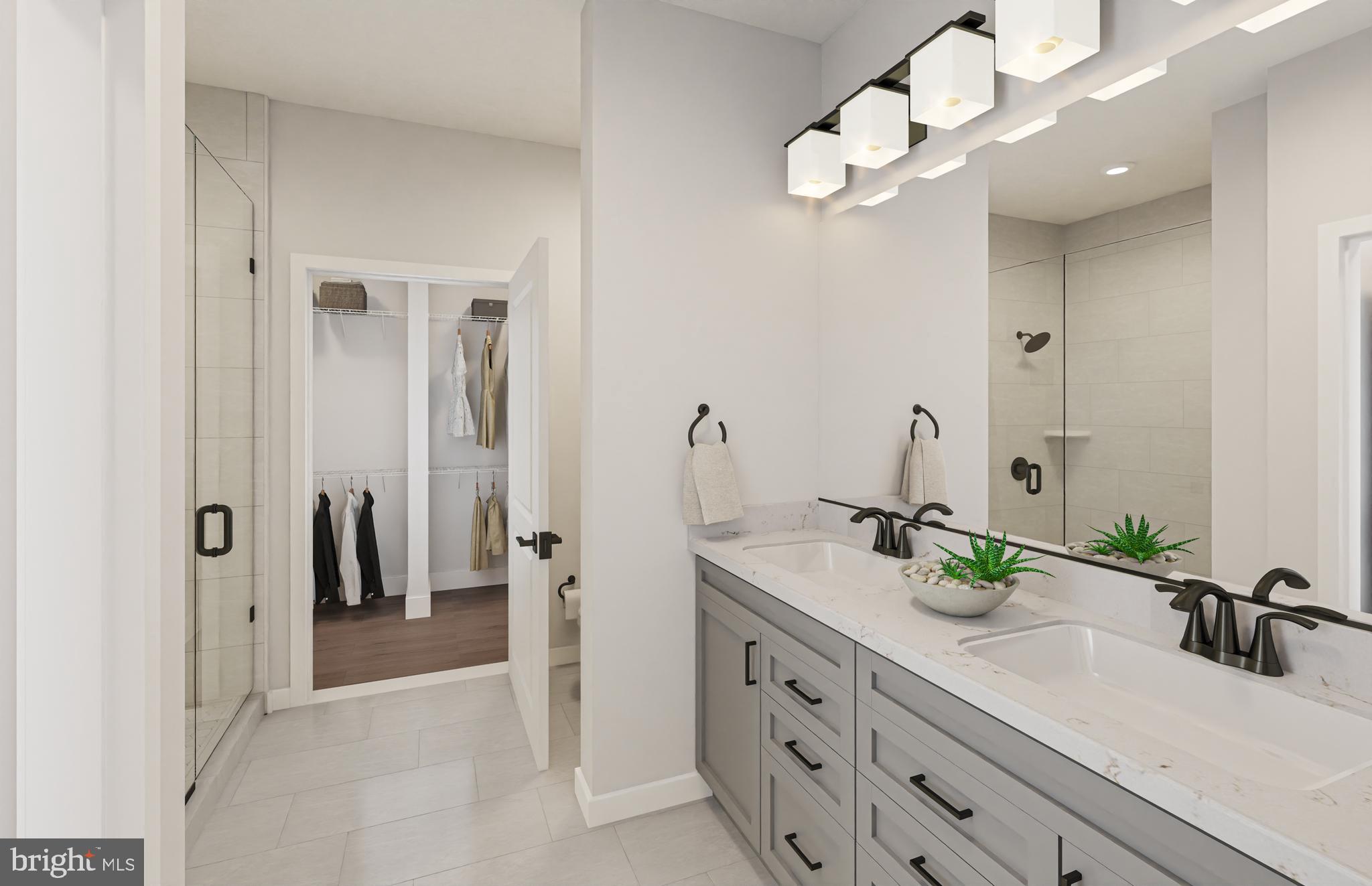1121 Fortune Terrace, Unit 5 Potomac, MD 20854 - Photo 7 of 12 a bathroom with a sink vanity and a mirror