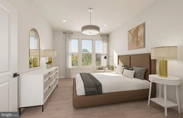 a view of walk in closet with clothes