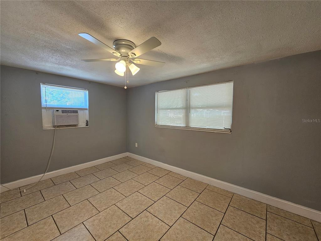 9210 Pegasus Avenue Port Richey, FL 34668 - Photo 11 of 19 a view of an empty room with a window
