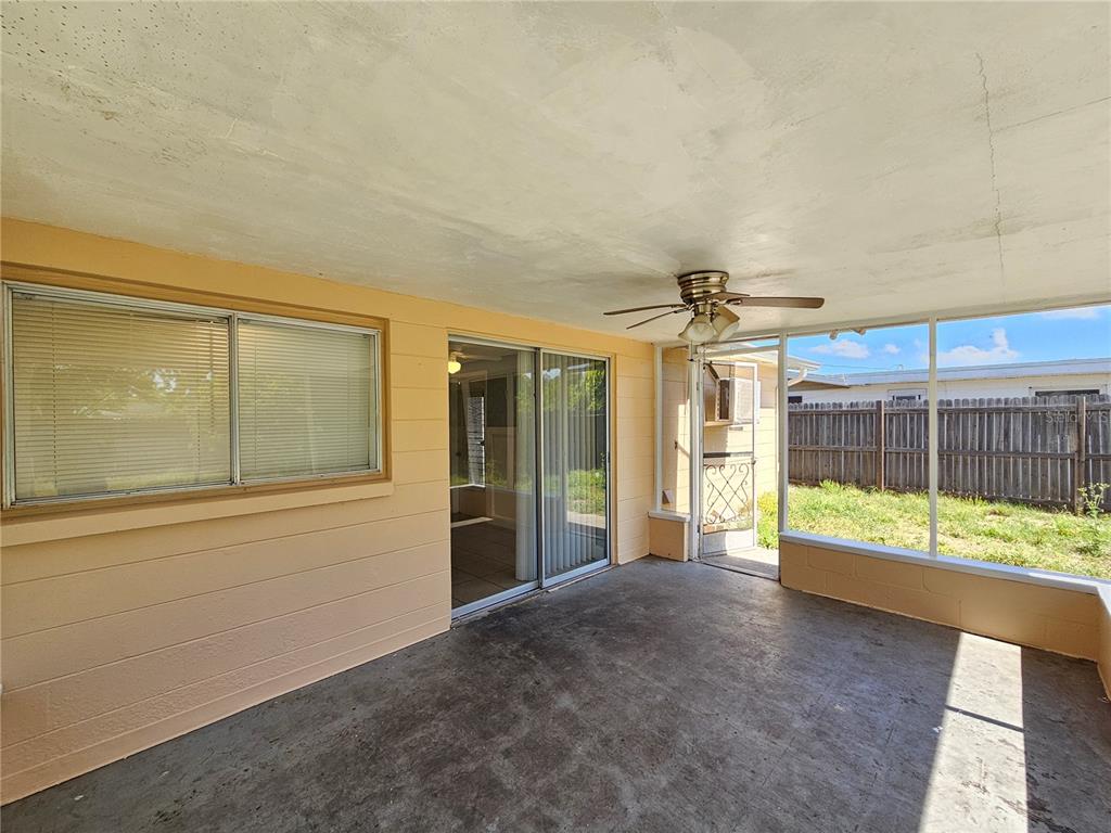 9210 Pegasus Avenue Port Richey, FL 34668 - Photo 16 of 19 a view of an empty room with a window