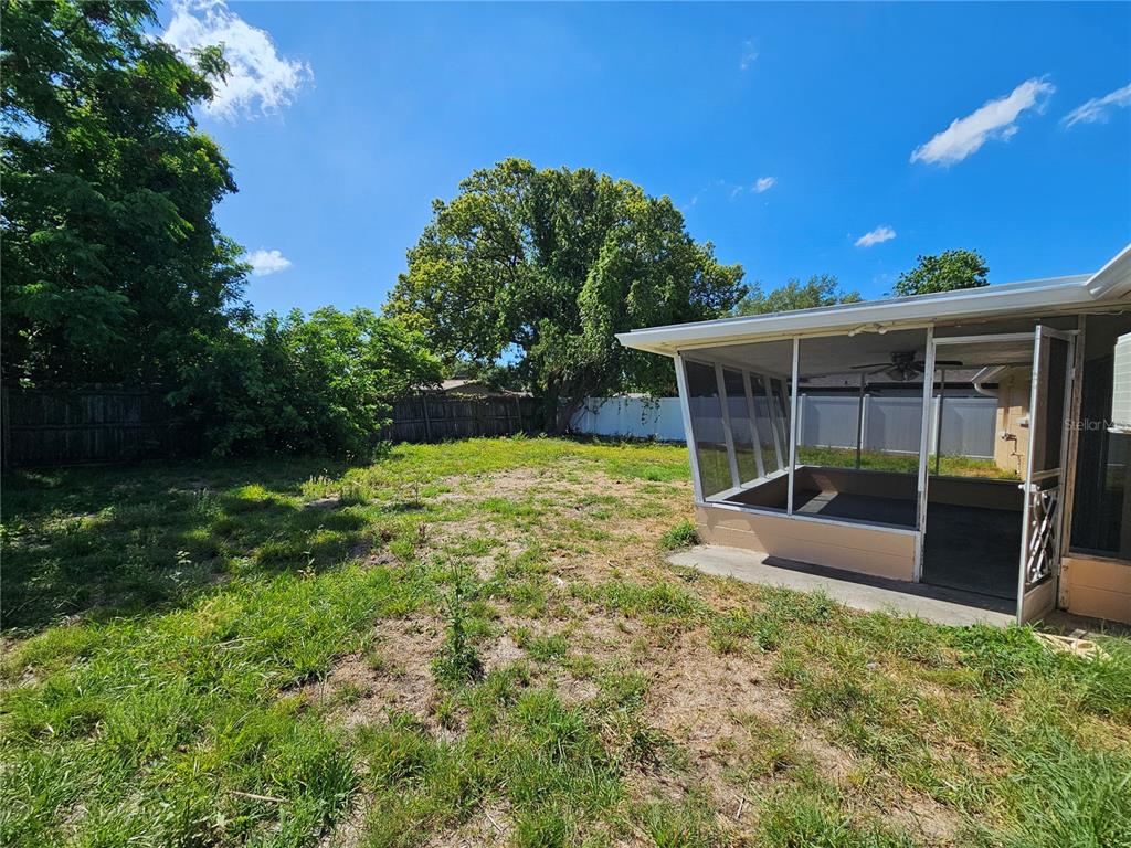 9210 Pegasus Avenue Port Richey, FL 34668 - Photo 17 of 19 a view of a house with a yard balcony and a patio