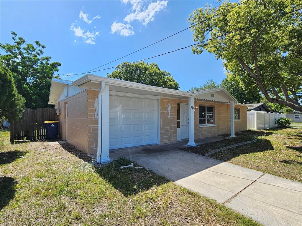 9210 Pegasus Avenue Port Richey, FL 34668 - Photo 2 of 19 a view of a house with a patio