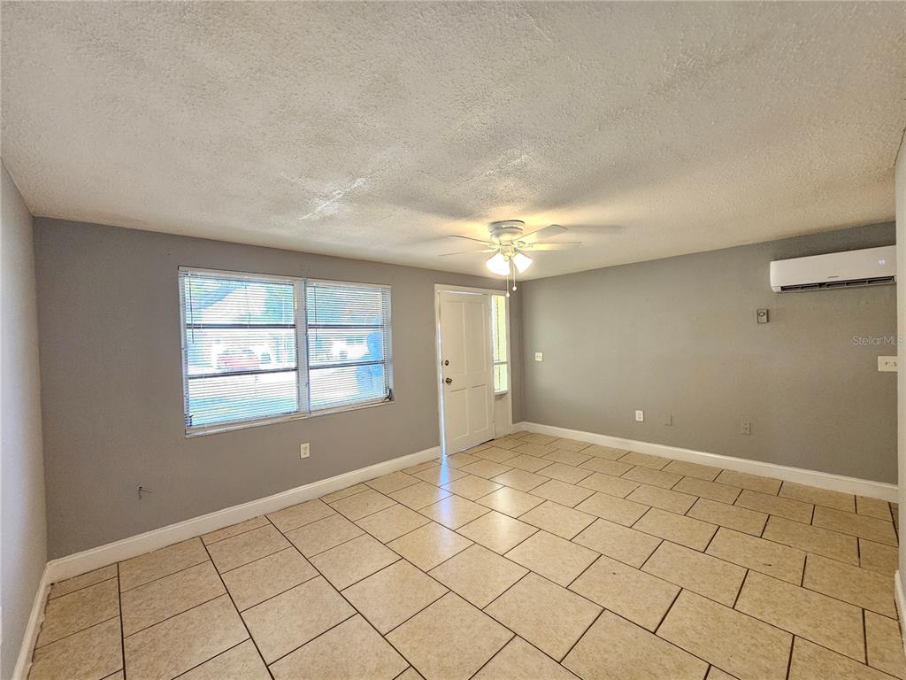 9210 Pegasus Avenue Port Richey, FL 34668 - Photo 5 of 19 a view of an empty room and window