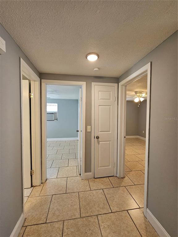 9210 Pegasus Avenue Port Richey, FL 34668 - Photo 9 of 19 a bathroom with a glass door shower and a sink
