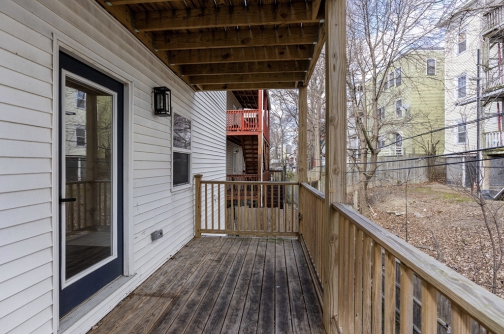 101 Draper Street, Unit 2 Boston, MA 02122 - Photo 15 of 19 a view of balcony with wooden floor