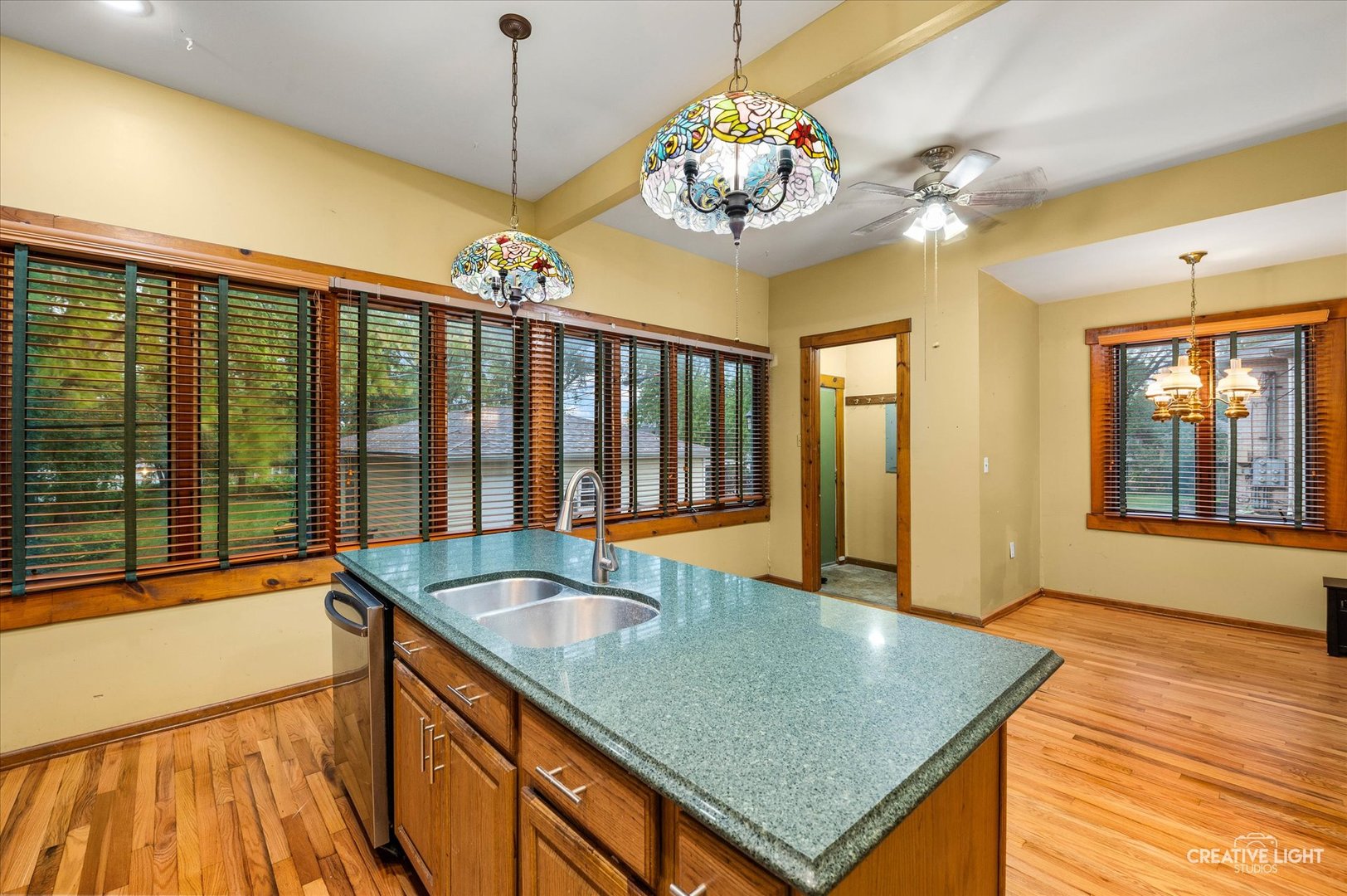 230 Comstock Street Joliet, IL 60436 - Photo 3 of 21 a view of a kitchen center island and living room view