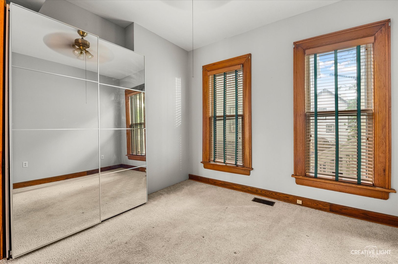 230 Comstock Street Joliet, IL 60436 - Photo 8 of 21 an empty room with windows