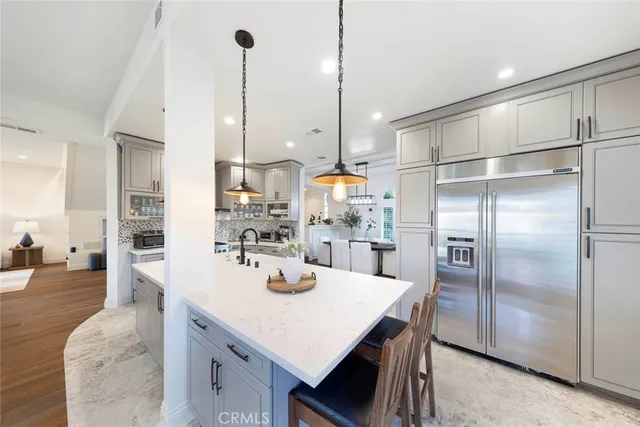 a view of a kitchen counter top space a sink and appliances