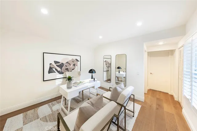 a living room with furniture and a potted plant