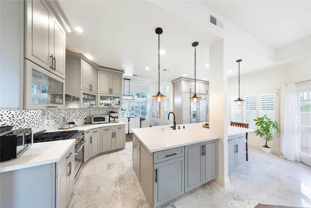 a kitchen with a sink stove and refrigerator