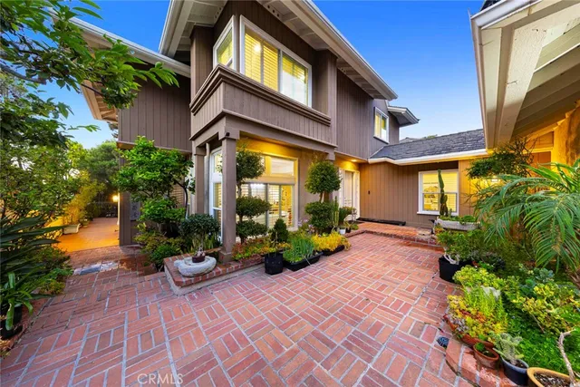 an aerial view of a house with a yard and garden
