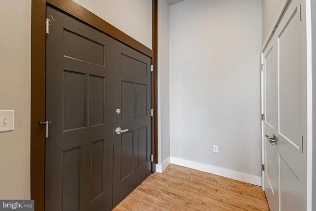 a view of a room with wooden floor