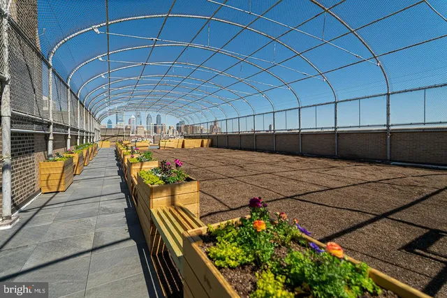 a view of a patio with table and chairs