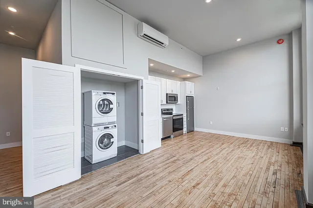 a view of a kitchen with refrigerator and stove