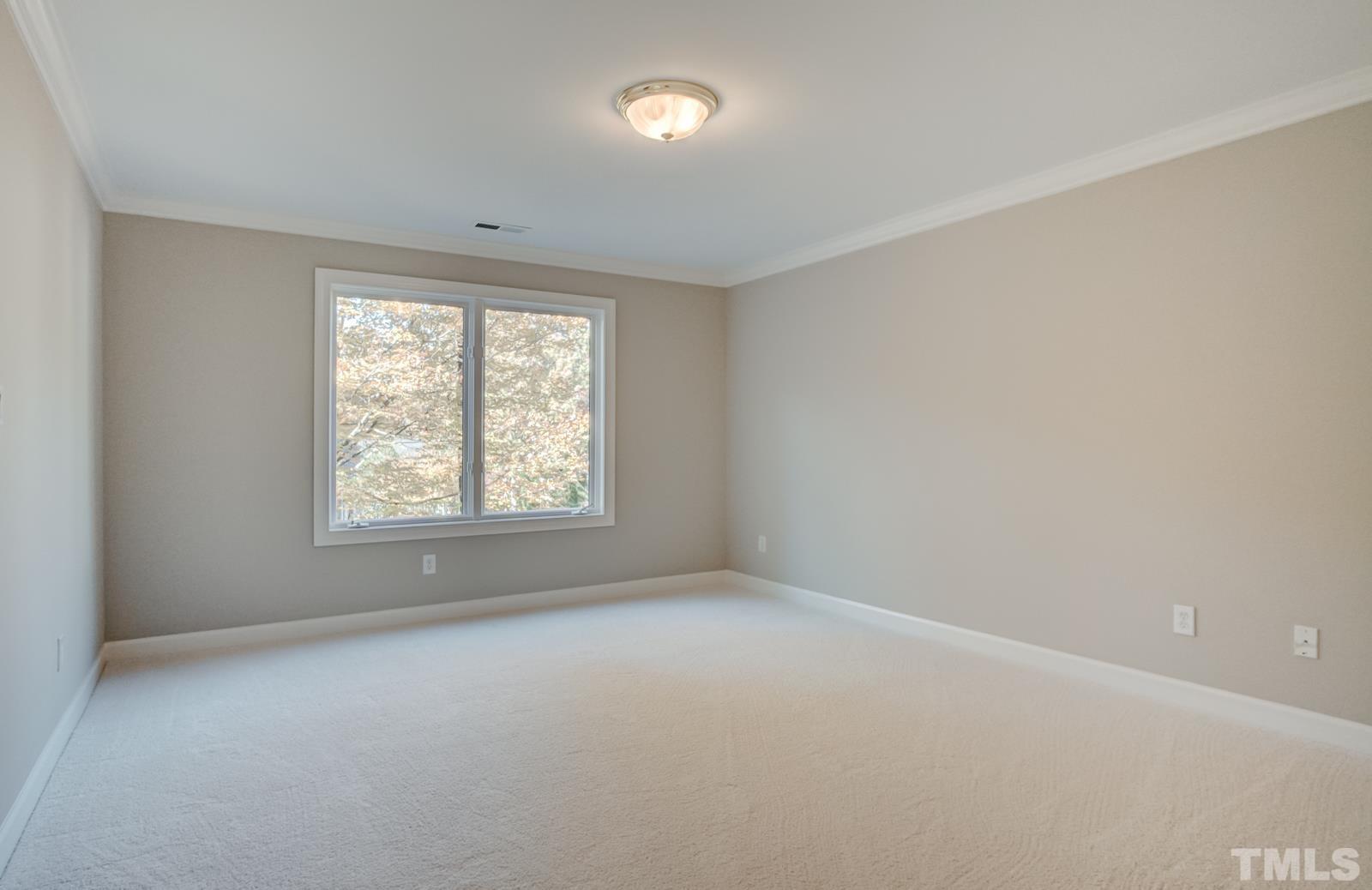 616 Bent Ridge Place Raleigh, NC 27615 - Photo 17 of 28 an empty room with a window