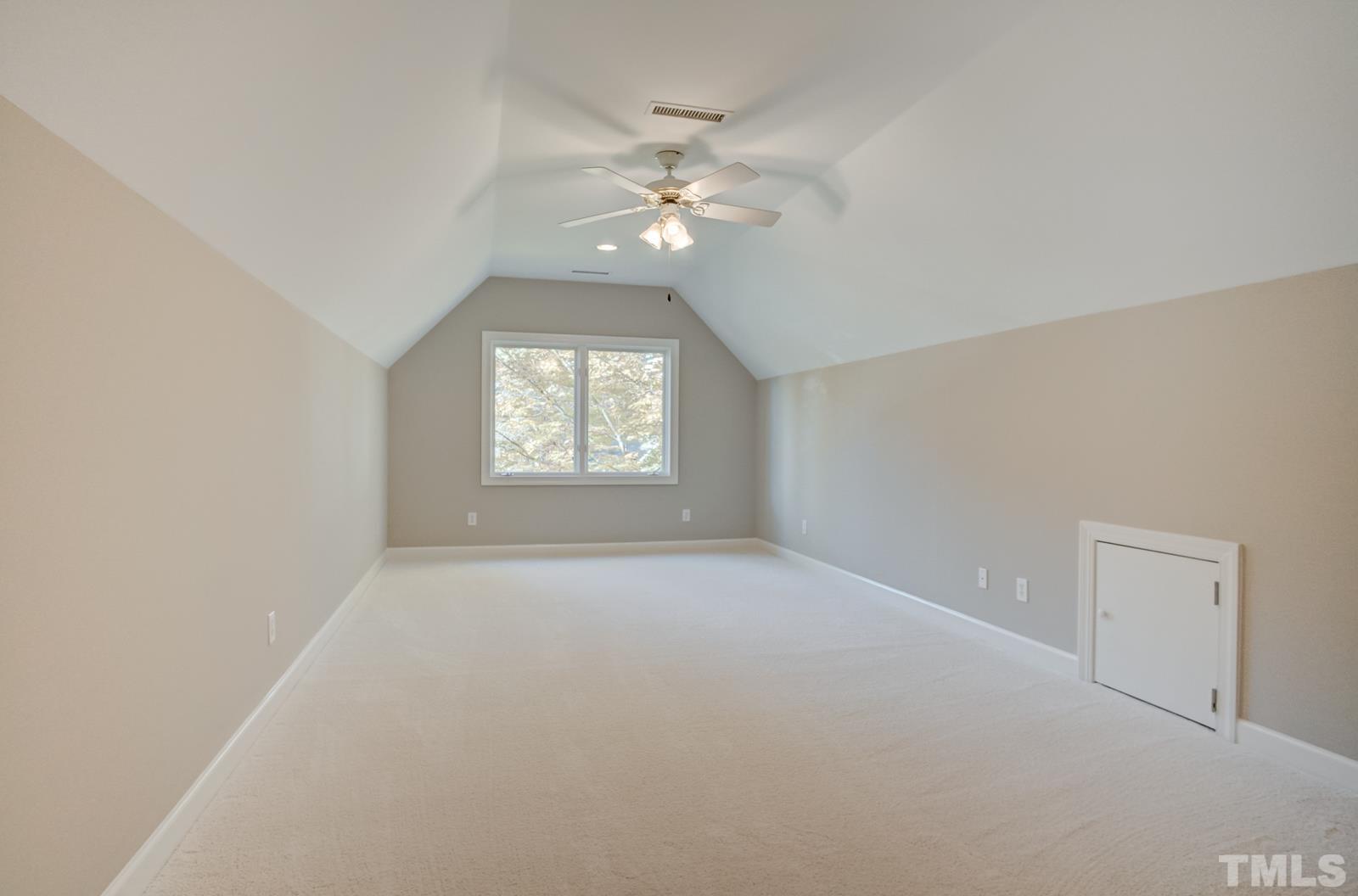 616 Bent Ridge Place Raleigh, NC 27615 - Photo 21 of 28 a view of an empty room with a window