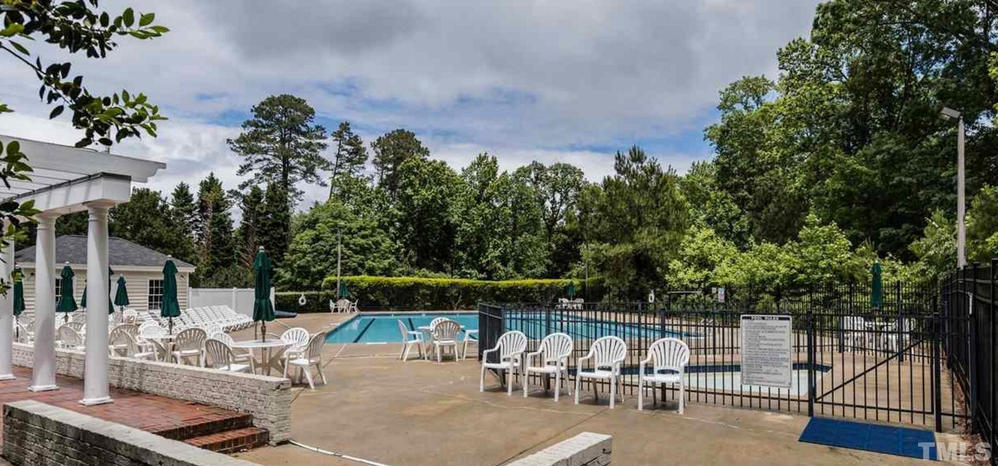 616 Bent Ridge Place Raleigh, NC 27615 - Photo 27 of 28 an outdoor space with patio and glass top table