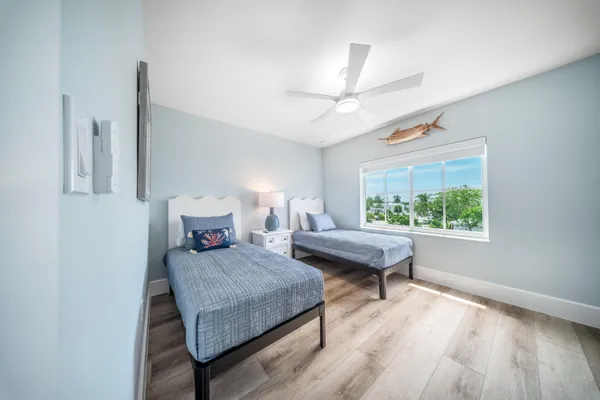 a bedroom with double bed and a window