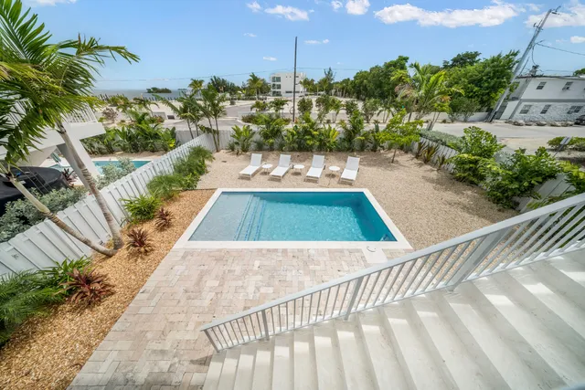 a view of a swimming pool with a patio